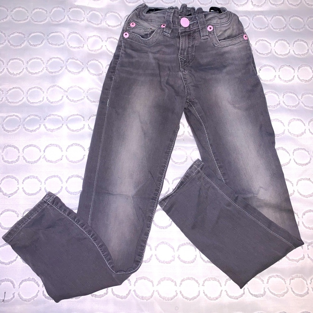 Gray True Religion Jeans pink trim.